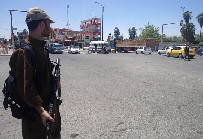 Een strijder van IS in Mosoel, Irak, in 2014.