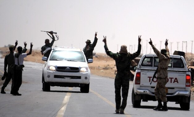 Rebellen kraaien victorie op de weg tussen Ajdabiya en Brega.