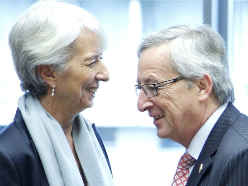 Directeur van het IMF Christine Lagarde praat met de premier van Luxemburg Jean-Claude Juncker.