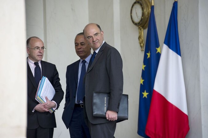 Frans Minister van Economie, Financiën en Buitenlandse Handel Pierre Moscovici (vooraan).