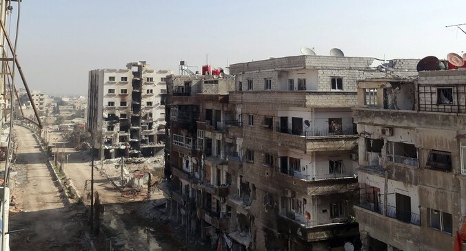 Een foto van het officiële Syrische persagentschap SANA zou beschadigde gebouwen tonen in Damascus.