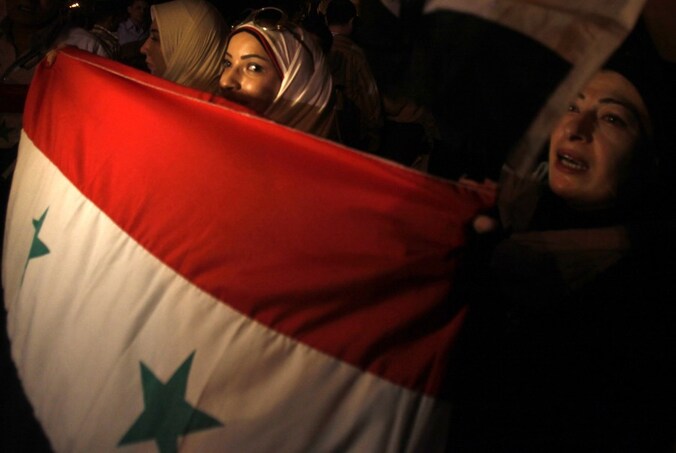 Syrische demonstranten steunen president Bashar al-Assad.