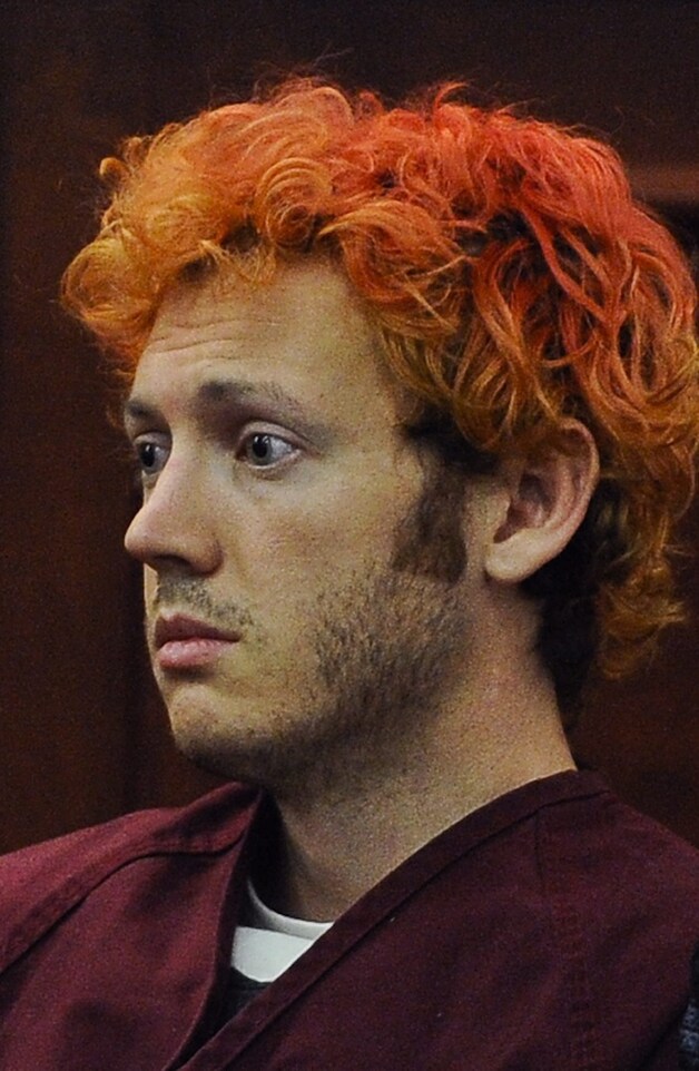 Schutter James Holmes kwam volgens ooggetuigen via een nooduitgang de bioscoopzaal binnen.