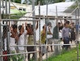 Asielzoekers op het eiland Manus. Canberra en Washington onderhandelden in november een "uitzonderlijk akkoord" dat inhoudt dat een onbekend aantal van de 1.600 vluchtelingen in de controversiële Australische asielcentra op de eilanden Manus, in Papoea-Nieuw-Guinea, en Nauru, door de VS opgevangen zal worden.