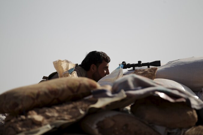 Een strijder van het Vrije Syrische Leger in Morek, in de provincie Hama.