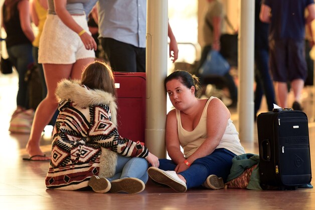 Toeristen in de luchthaven van Sharm-el-Sheikh.