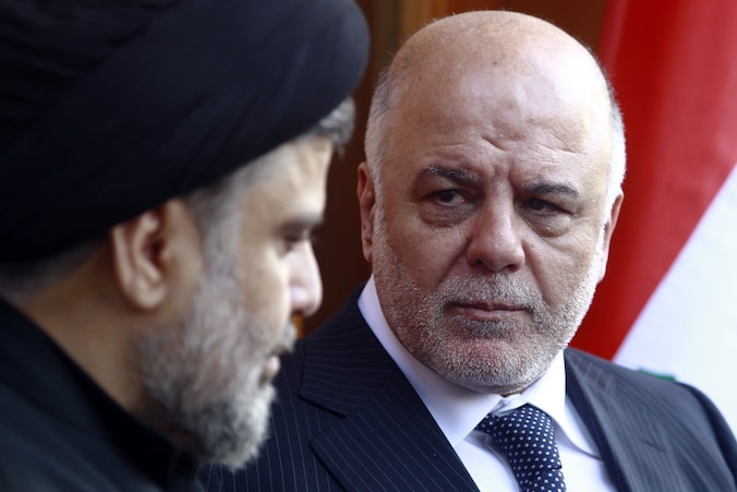 Haider al-Abadi (rechts)met de radicale Moqtada al-Sadr