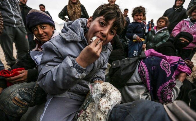 Syrische vluchtelingen uit Aleppo in een kamp vlakbij de grensstad Azaz.