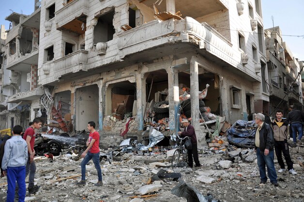 Kapotgeschoten gebouwen in de Syrische stad Homs.
