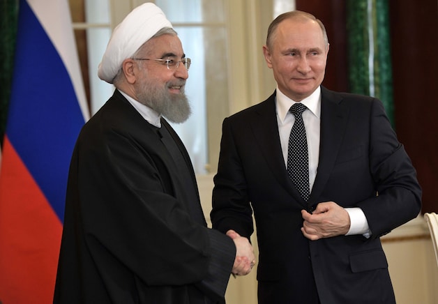 Poetin met de Iraanse president Hassan Rouhani.