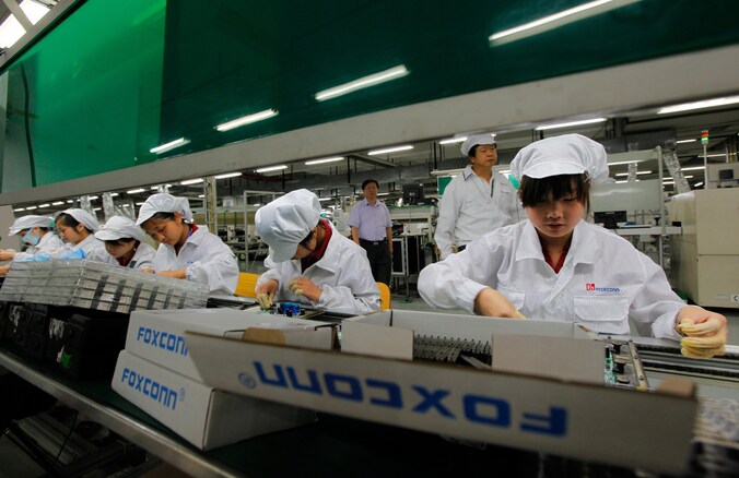 Werknemers van Foxconn in het Chinese Shenzhen.