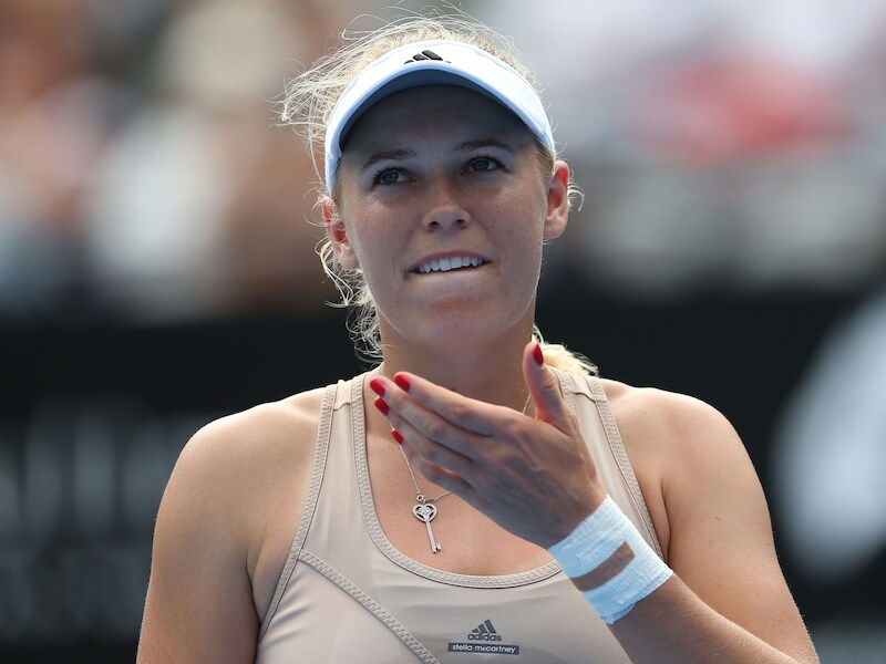 Het gezicht van Caroline Wozniacki spreekt boekdelen, de Deense moest in Sydney noodgedwongen de strijd staken.