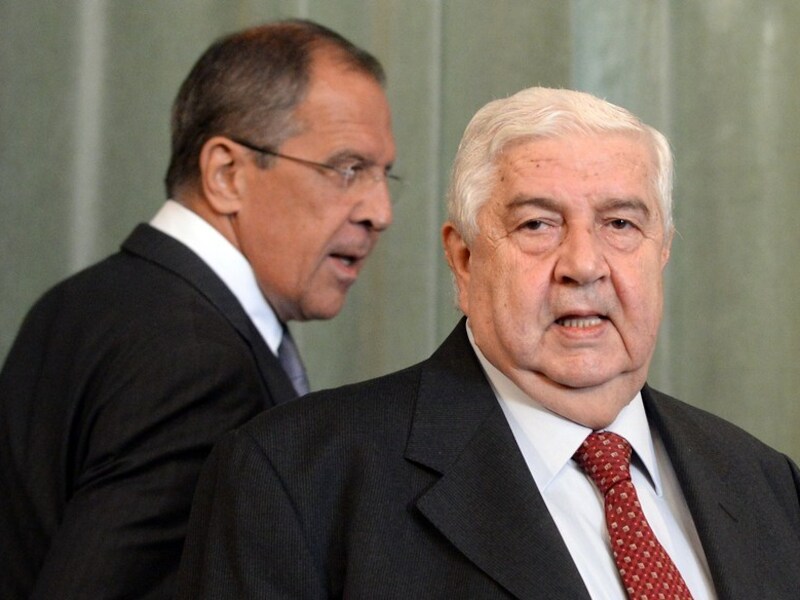 De Russische buitenlandminister Sergej Lavrov (links) en zijn Syrische ambtgenoot Walid Muallem.