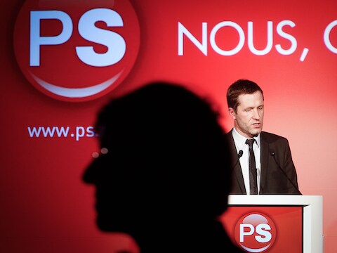 Premier Di Rupo in de schaduw van zijn PS-voorzitter Paul Magnette.